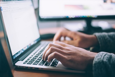 A person working at a laptop.